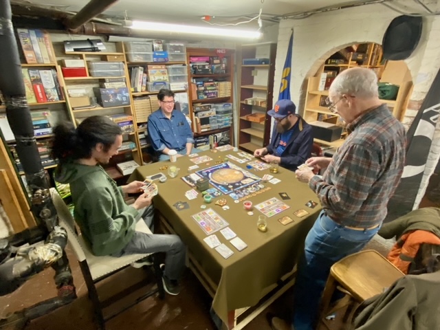 Club favorite Terraforming Mars shows up on the tables about once a week. Club founder Joe is at right.